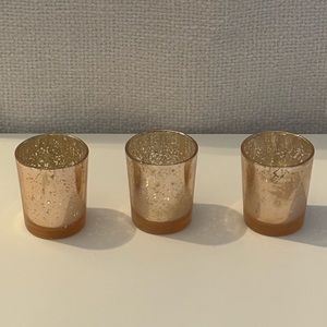 Three god/rose gold flecked votives